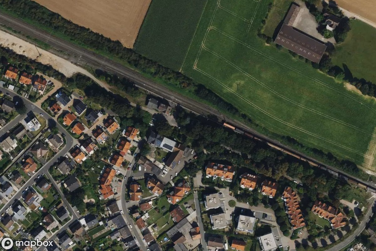 Aerial satellite view of Bahnhofsgebäude, an abandoned Railway Station in Assenheim, Germany