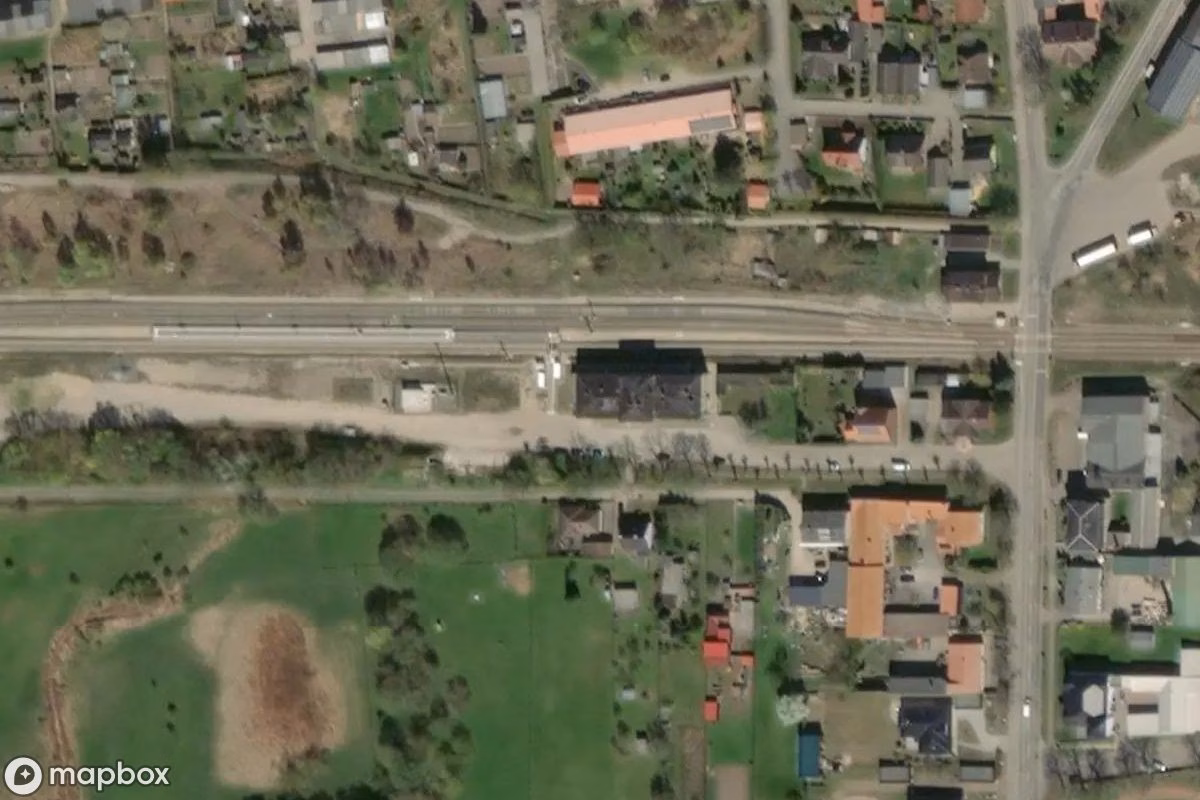 Aerial satellite view of Bahnhofsgebäude, an abandoned Railway Station in Strasburg (Uckermark), Germany