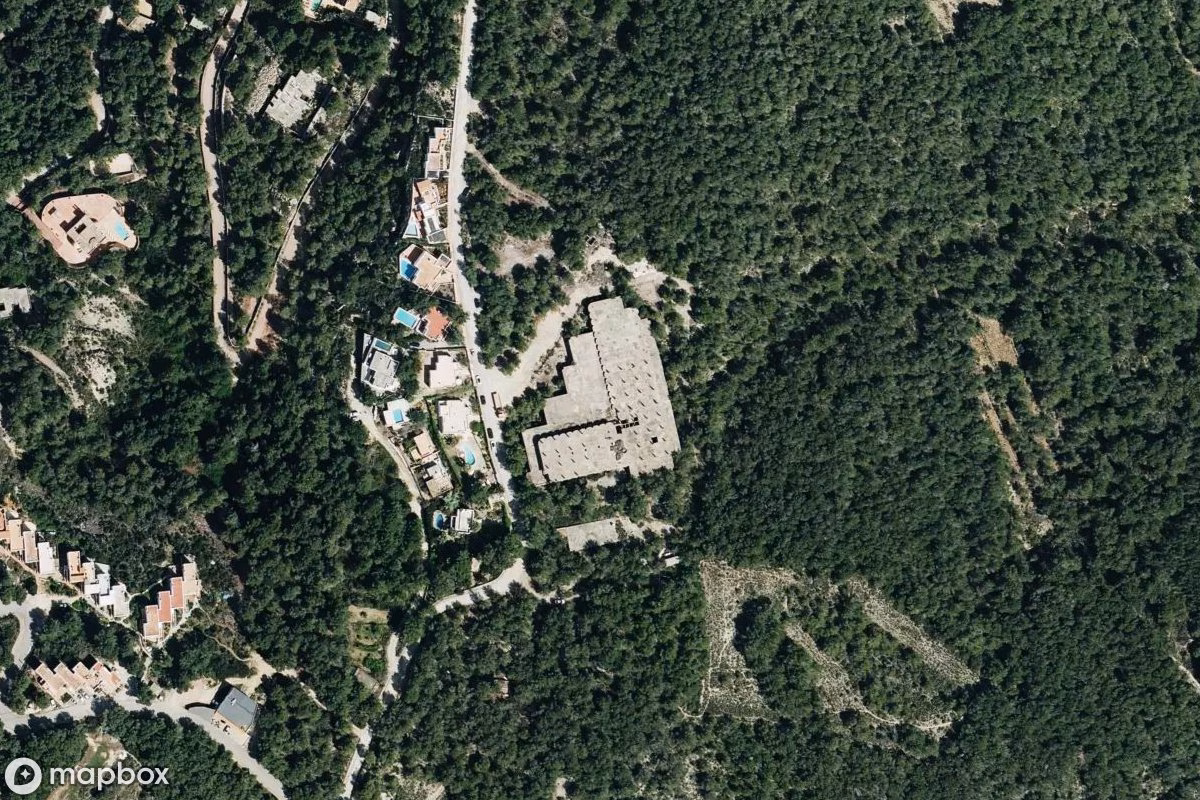 Aerial satellite view of Hotel, an abandoned Hotel in Sant Joan de Labritja, Spain