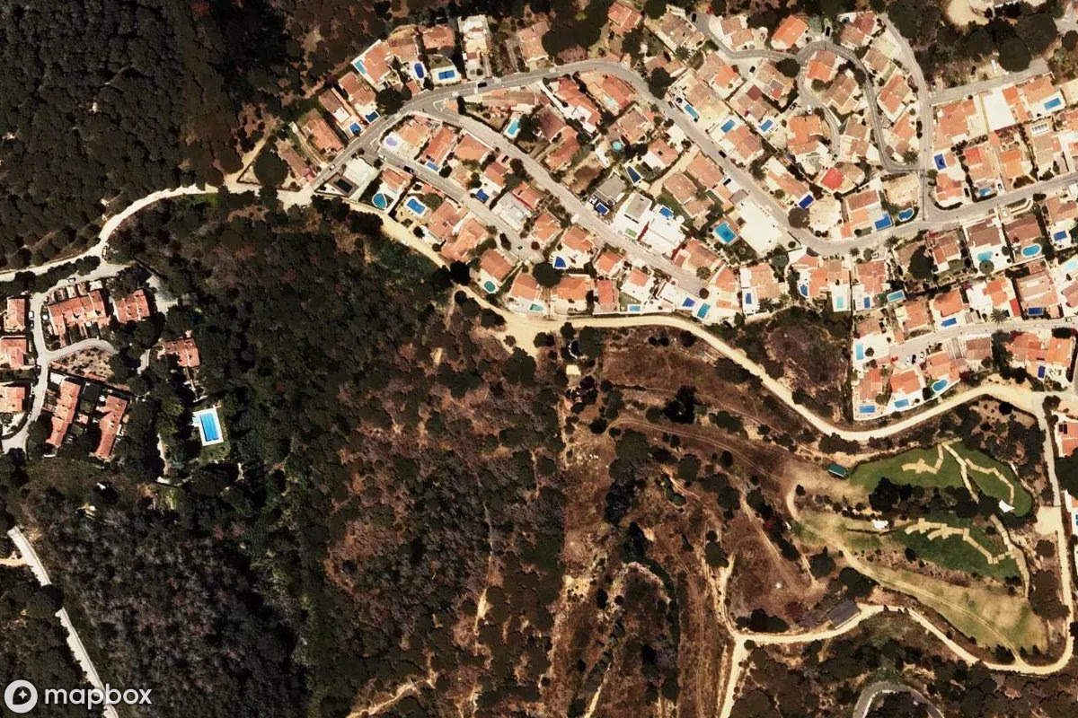 Aerial satellite view of Golfanlage, an abandoned  in Lloret de Mar, Spain